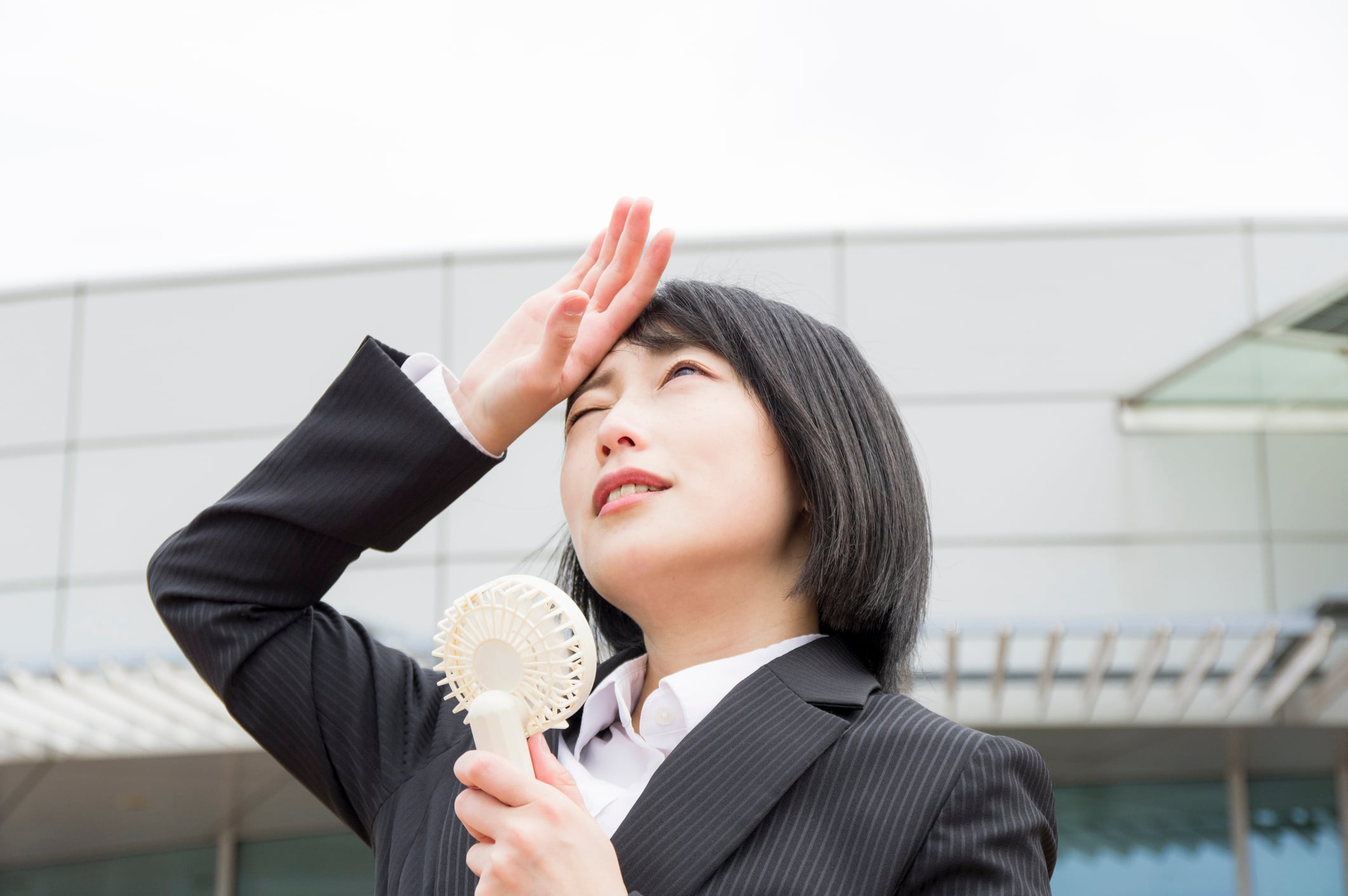 Woman perspiring under hot weather