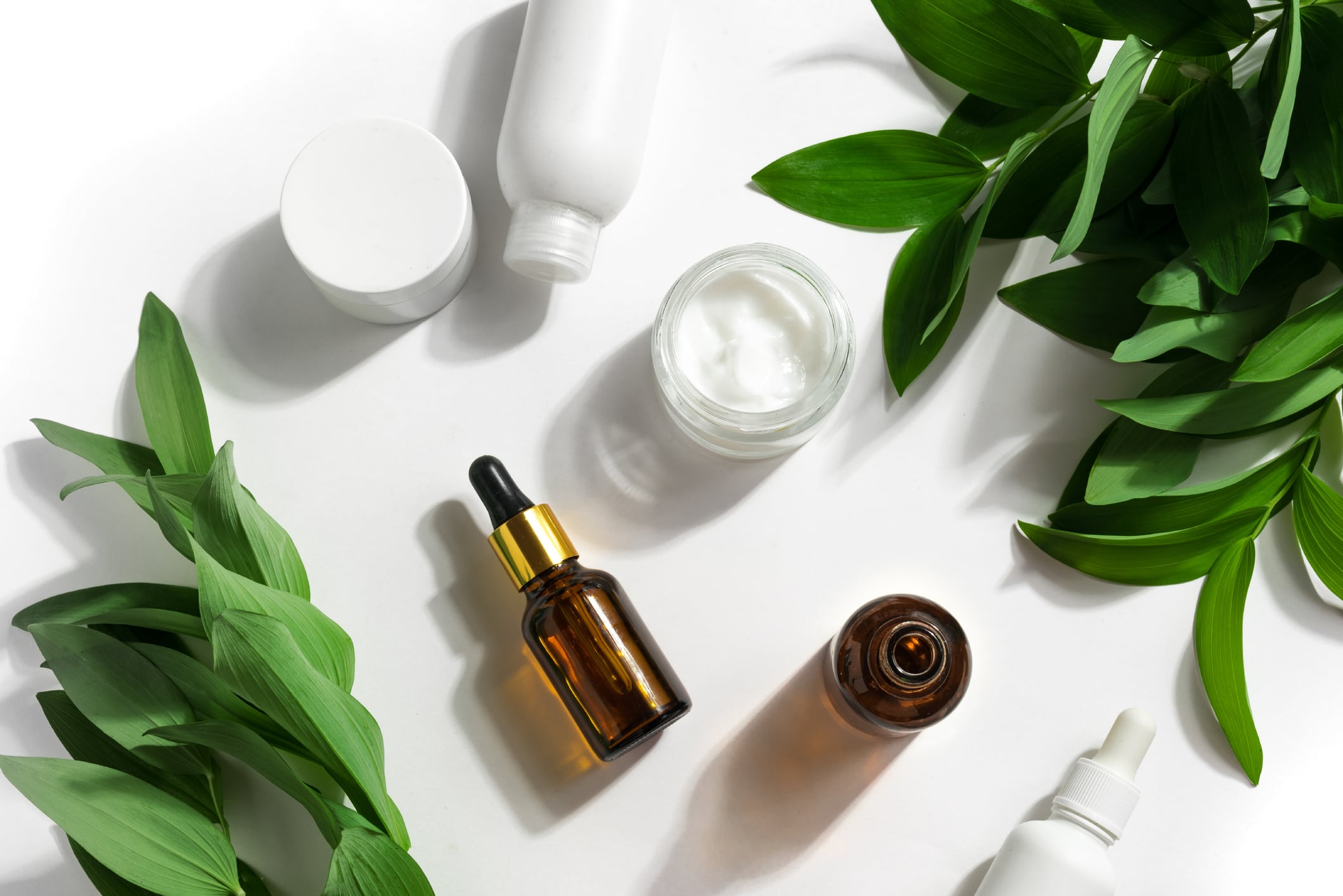 Skin care products and green plants